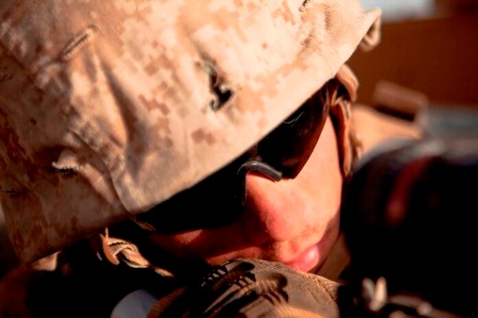 Lance Cpl. Dustin Dodd, a Habersham, Ga., native and turret gunner with Combat Logistics Regiment 2, Regional Command (Southwest), looks through the sights on his machine gun during a combat logistics patrol in Helmand province, Afghanistan, Aug. 28, 2013. Dodd commonly stands in the turret for more than eight consecutive hours at a time on convoys that can last for days. (Photo By: Cpl. Paul Peterson)