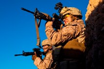 Lance Cpl. Brandon Bowker, a Roberta, Ga., native and rifleman with 1st Battalion, 9th Marines, scans the desert for threats during a firefight with insurgents near the Bari Gul Bazaar, Nad Ali District, Helmand province, Afghanistan, Dec. 4, 2013. Nearly 100 Marines and coalition allies engaged in a prolonged firefight with insurgents while patrolling the area to interdict Taliban movements and weapons caches and gather intelligence around the bazaar. The interdiction force landed by helicopter during the cover of night and began sweeping through the area with the help of Afghan forces and interpreters before engaging Taliban fighters in a firefight that lasted nearly four hours.(Photo By: Cpl. Paul Peterson)