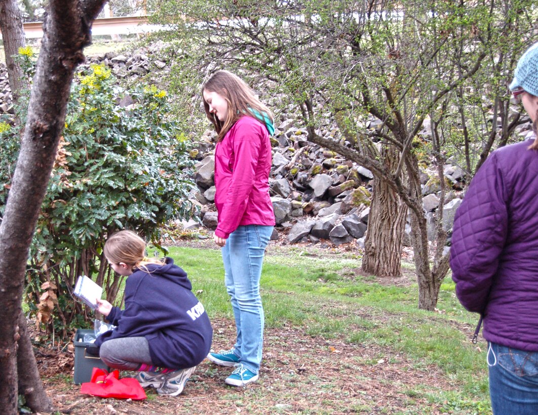 The Dalles Lock and Dam Visitor Center hosted its first-ever geocaching event Sat., March 29, 2014.

The Amazing Race, Geocache Style drew more than 50 people of all ages and skill levels, who each braved the erratic weather to participate in this outdoor treasure hunt.

For many participants, it was their first experience with geocaching, but park rangers and volunteers assisted them with using a GPS to guide them to the hidden treasures.

 Five geocaches were placed specifically for this event at Seufert and Patterson parks and the connecting Riverfront Trail. Each geocache was stuffed with items promoting water safety, reminding everyone to play it safe and always wear a life jacket!

Upon completion of the race, all participants received a certificate of completion, signed by a park ranger.  

When a family of smiling faces returned to the visitor center, they were asked if they would go geocaching again. “Yes! We are hooked now,” said participant Jenni Nuzzi.

“It is great to see people bringing their friends and family outdoors to use technology and enjoy the day," said Emma Nelson, a Park Ranger at The Dalles Lock and Dam. "Despite the moody weather, everyone left with goodies in their bags and smiles on their faces.” 