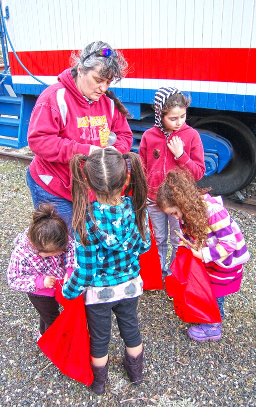 The Dalles Lock and Dam Visitor Center hosted its first-ever geocaching event Sat., March 29, 2014.

The Amazing Race, Geocache Style drew more than 50 people of all ages and skill levels, who each braved the erratic weather to participate in this outdoor treasure hunt.

For many participants, it was their first experience with geocaching, but park rangers and volunteers assisted them with using a GPS to guide them to the hidden treasures.

 Five geocaches were placed specifically for this event at Seufert and Patterson parks and the connecting Riverfront Trail. Each geocache was stuffed with items promoting water safety, reminding everyone to play it safe and always wear a life jacket!

Upon completion of the race, all participants received a certificate of completion, signed by a park ranger.  

When a family of smiling faces returned to the visitor center, they were asked if they would go geocaching again. “Yes! We are hooked now,” said participant Jenni Nuzzi.

“It is great to see people bringing their friends and family outdoors to use technology and enjoy the day," said Emma Nelson, a Park Ranger at The Dalles Lock and Dam. "Despite the moody weather, everyone left with goodies in their bags and smiles on their faces.” 