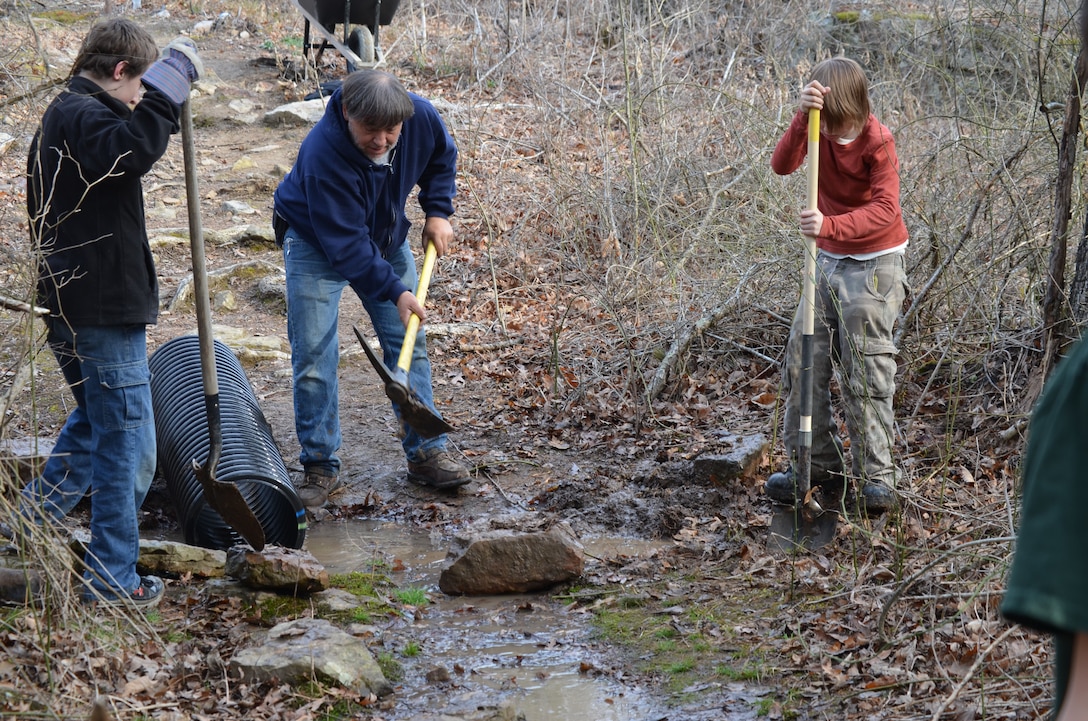 Heber Springsl Boy Scout Troop 754 and volunteers make needed repairs to the U.S. Army Corps of Engineers Mossy Bluff Trail on Greers Ferry Lake. The repairs consisted of constructing retaining walls and a drainage system to reduce erosion. The scouts were able to resurface a portion of the trail making it easier for hikers to traverse.