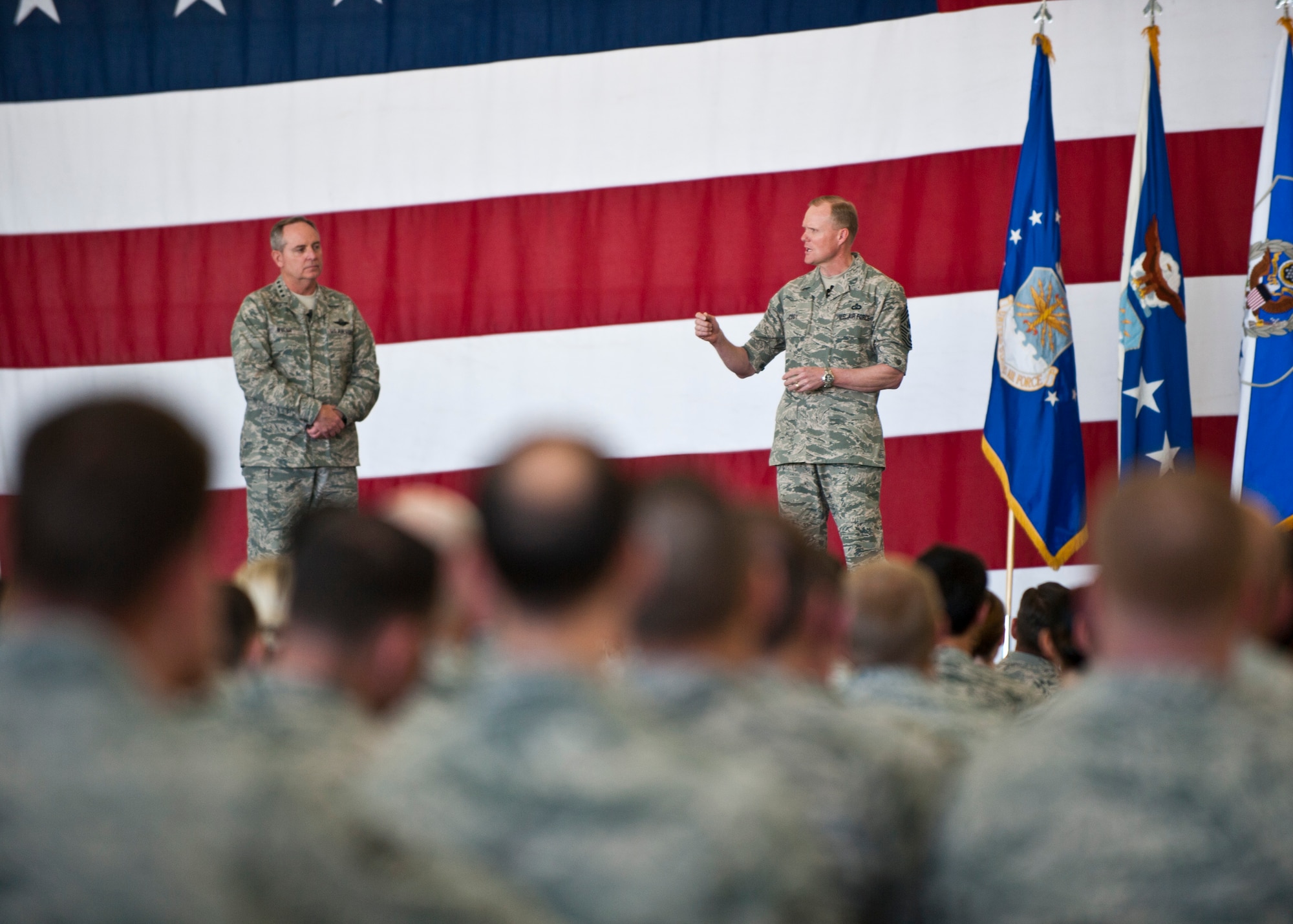 Chief Master Sgt. of the Air Force James A. Cody speaks to Airmen April 7, 2014 during a town-hall style meeting at Nellis Air Force Base, Nev. Cody, along with Air Force Chief of Staff Gen. Mark A. Welsh III, and their spouses, Athena and Betty, visited Nellis to receive an update on the mission and thank Airmen and their families for their sacrifice and service. (U.S. Air Force photo by Senior Airman Jason Couillard)