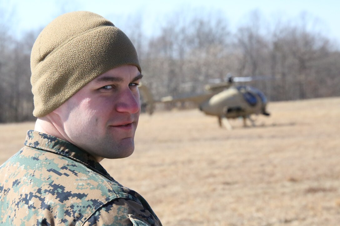 Lance Cpl. Cody Barss lands a helicopter at Marine Corps Base Quantico utilizing Autonomous Aerial Cargo/Utility System (AACUS) technology on Feb. 27, 2014. The landing was part of an Office of Naval Research demonstration for the AACUS program.