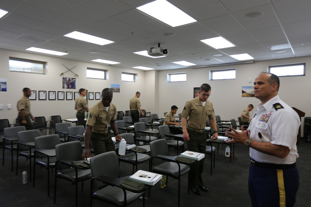 Army Sgt. Maj. Brian M. Rauschuber, an instructor with Joint Special Operation Forces Senior Enlisted Academy, waits for Marines attending the 1st Intelligence Battalion Corporals Course to be seated for a class on joint operations, aboard Camp Pendleton Calif., April 4. Rauschuber, a former special operator, spoke about the importance of joint special operations and why the Department of Defense incorporates all different branches of service. 
