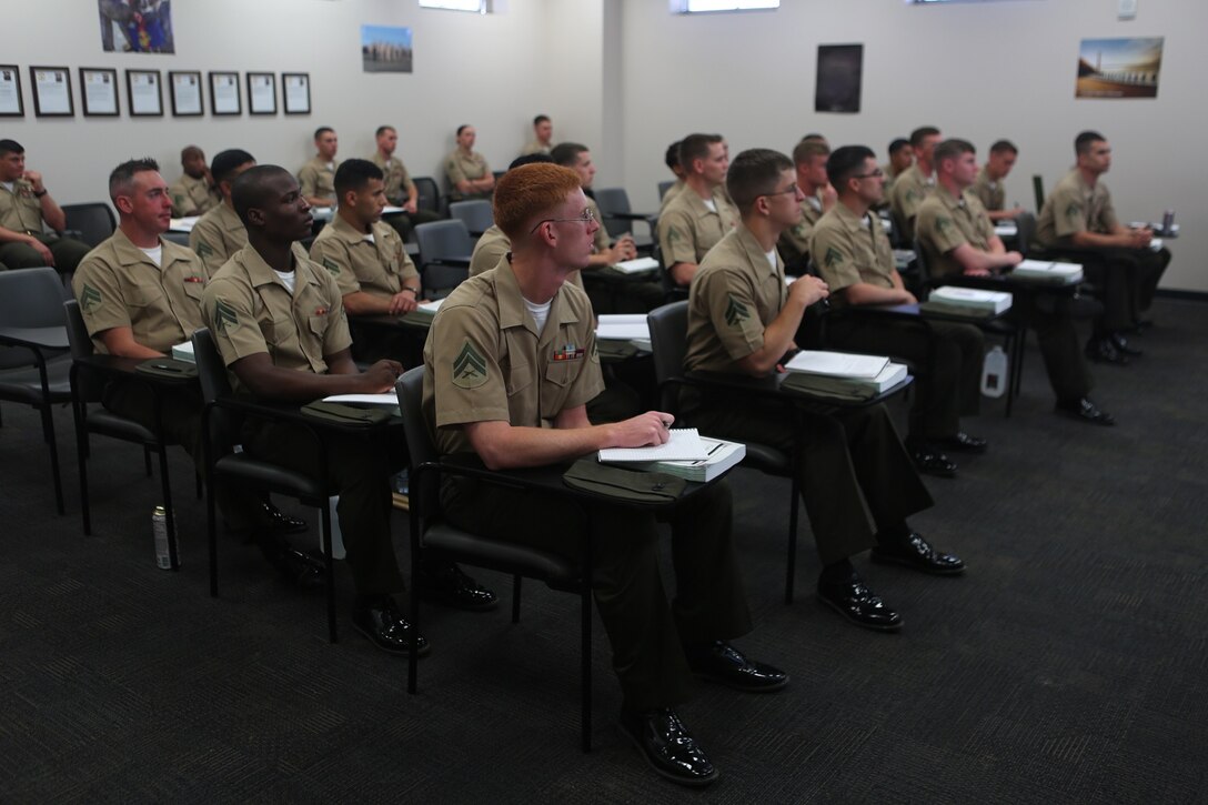 Marines attending the 1st Intelligence Battalion Corporals Course pay close attention during a class on joint operations given by Army Sgt. Maj. Brian M. Rauschuber, an instructor with Joint Special Operation Forces Senior Enlisted Academy, aboard Camp Pendleton Calif. April 4. During the lecture coporals learned about the importance of joint special operations and the way the Department of Defense operates when incorporating all diferent branches of service. 