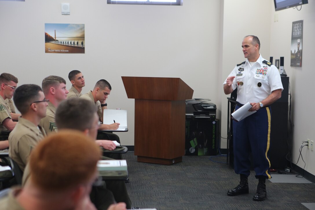 Army Sgt. Maj. Brian M. Rauschuber, an instructor with Joint Special Operation Forces Senior Enlisted Academy, gives Marines attending the 1st Intelligence Battalion Corporals Corse a class on Joint Operations aboard Camp Pendleton Calif., April 4. Rauschuber, a former special operator, spoke about the importance of joint special operations and why the Department of Defense incorporates all different branches of service. 