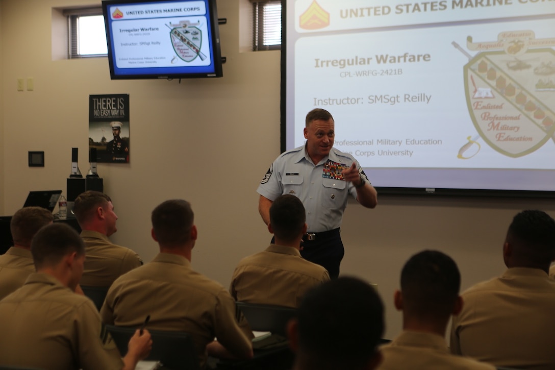 Senior Master Sgt. Bradley Reilly, an instructor with Joint Special Operation Forces Senior Enlisted Academy, gives Marines attending the 1st Intelligence Battalion Corporals Corse a class on irregular warfare aboard Camp Pendleton Calif., April 4. Reilly, a Silver Star recipient, talked about his experiences during combat and explained to the corporals why it is important to know the difference between conventional and irregular warfare. 