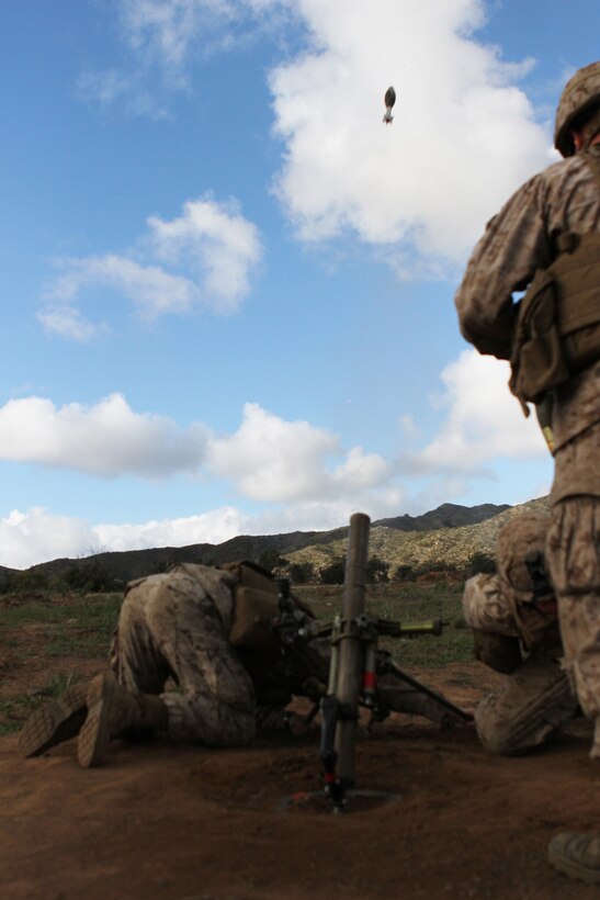 Mortarmen, from Fox Company, 2nd Battalion, 4th Marine Regiment, fires mortars during a squad and fire team maneuver exercise aboard Marine Corps Base Camp Pendleton, April 2, 2014. The exercise allowed Marines from the company to re-familiarize themselves with their weapon systems as well as 60 mm mortars, M240 B machine guns, Light Anti-tank Weapon (LAW) and while practicing squad and fire team tactics.

