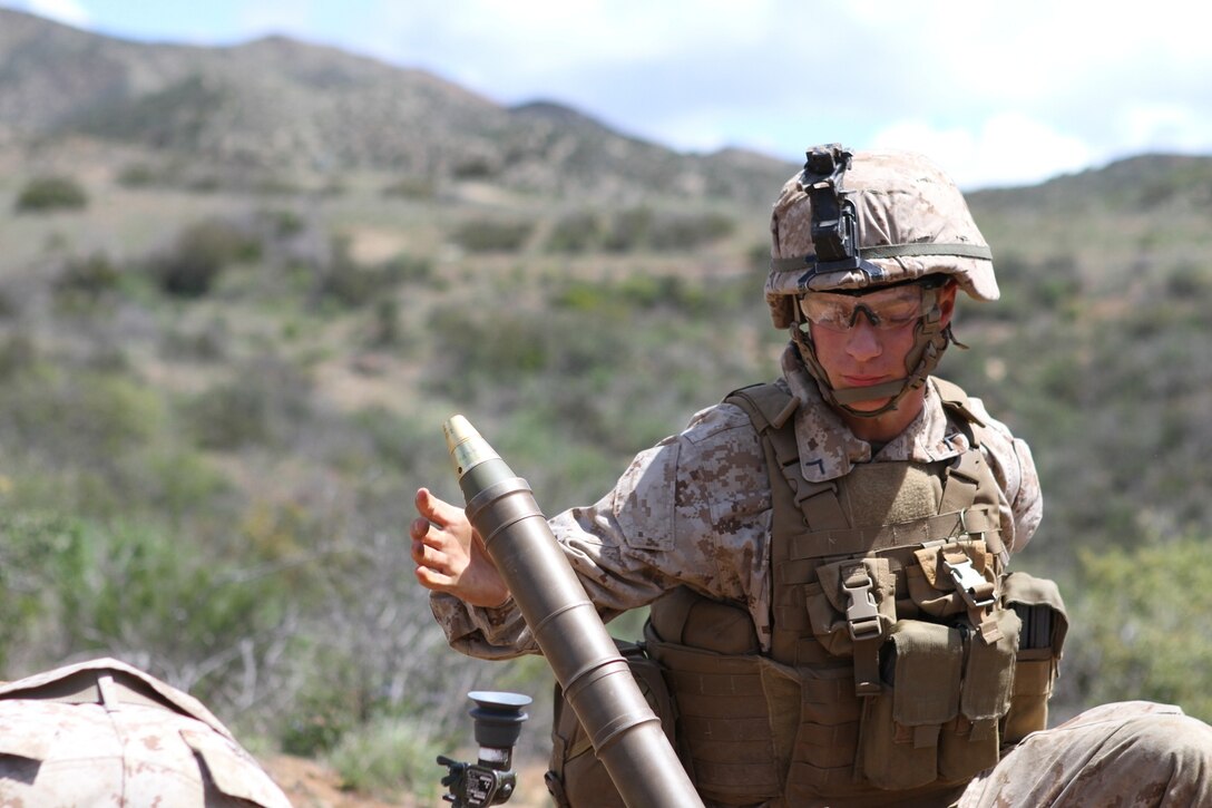 Mortarmen from Fox Company, 2nd Battalion, 4th Marine Regiment, prepare rounds for their next fire mission during a squad and fire team maneuver exercise aboard Marine Corps Base Camp Pendleton, April 2, 2014. The exercise allowed Marines from the company to re-familiarize themselves with their weapon systems as well as 60 mm mortars, M240 B machine guns, Light Anti-tank Weapon (LAW) and while practicing squad and fire team tactics.


