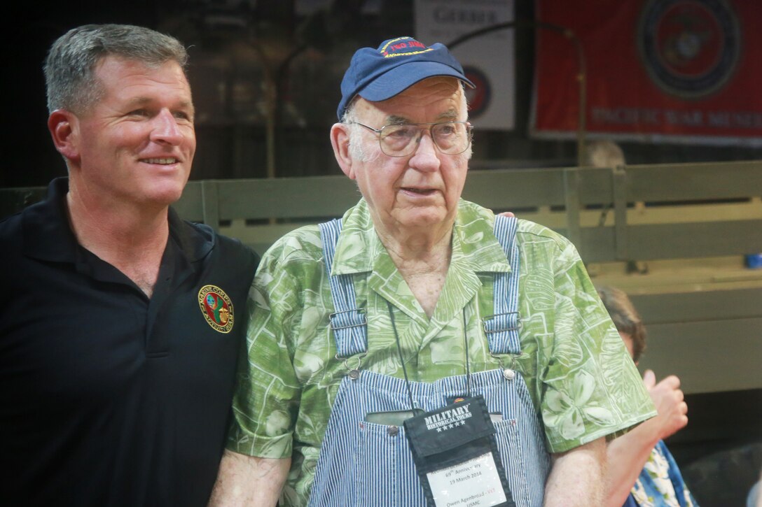 Colonel Philip Zimmerman, Marine Corps Activity Guam Officer in Charge, stands with Iwo Jima veteran Owen Agenbroad during the Iwo Jima Association of America’s sendoff of their historical tour, March 20, 2014 Guam.  The veterans and other participants toured historical islands including Iwo Jima, culminating at the gathering at the John Gerber Pacific War Museum.