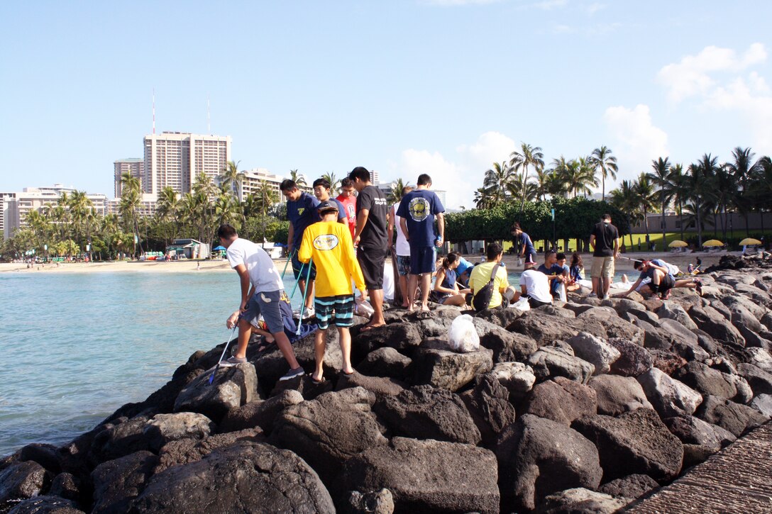 HONOLULU (APRIL 5, 2014) - Approximately 30 volunteers from the Punahou Junior ROTC program (which includes cadets from other area high schools and some homeschooled students) and Corps’ employees and family members joined forces April 5 to clean up the beach and berm area at the Corps’ Pacific Regional Visitor Center at Fort DeRussy in Waikiki. Altogether about 45 volunteers participated in this Earth Month event. 