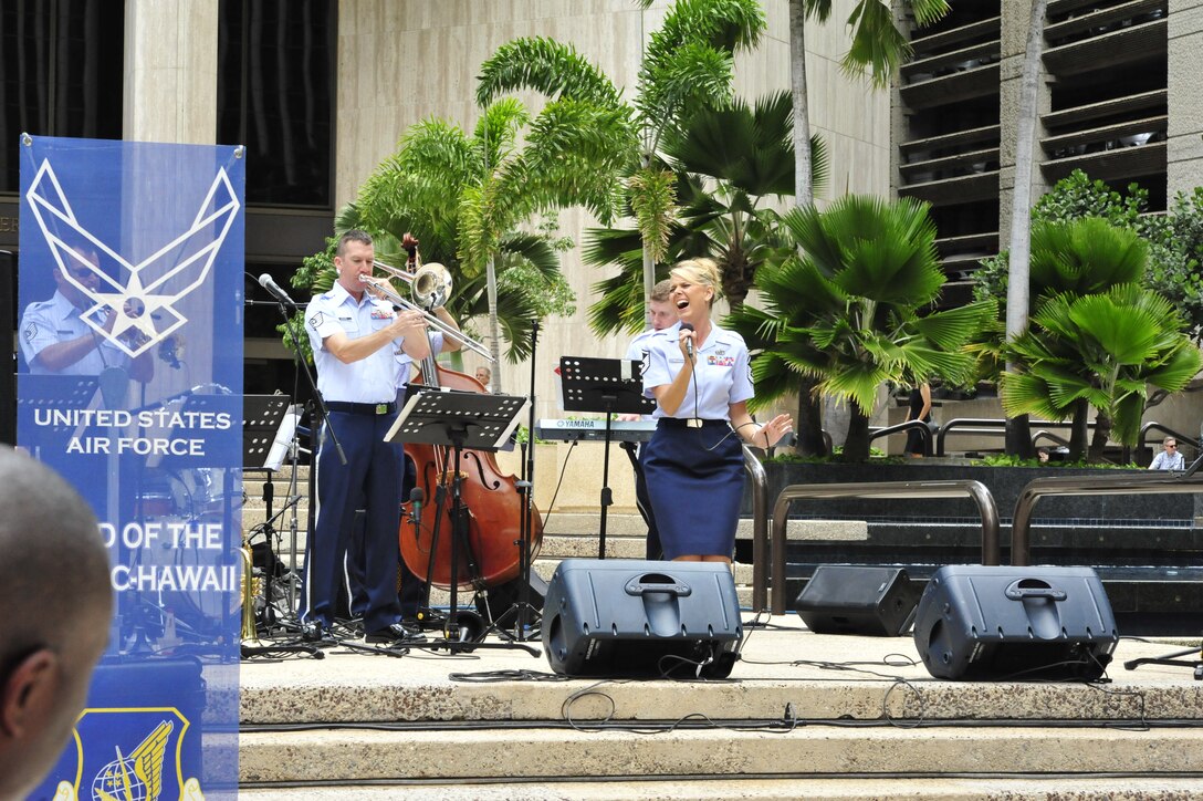 HONOLULU, Hawaii – MSgt Lara Murdzia entertains the audience as she belts out "Almost Like Being in Love". Papana, the jazz ensemble with the USAF Band of the Pacific-Hawaii, played at Bishop Square, Apr. 3, 2014. The Band of the Pacific-Hawaii plays over 100 annual public concerts, in efforts to build stronger community and military ties. (US Air Force Photo/SSgt Courtney Clifford/released)