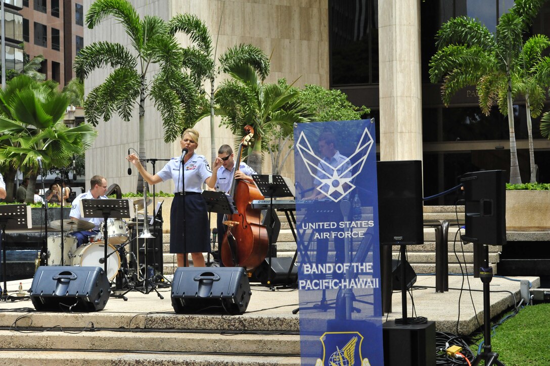 HONOLULU, Hawaii – MSgt Lara Murdzia charms the crowd with her rendition of "Taking a Chance on Love". Papana, the jazz ensemble with the USAF Band of the Pacific-Hawaii, played at Bishop Square, Apr. 3, 2014. The Band of the Pacific-Hawaii plays over 100 annual public concerts, in efforts to build stronger community and military ties. (US Air Force Photo/SSgt Courtney Clifford/released)