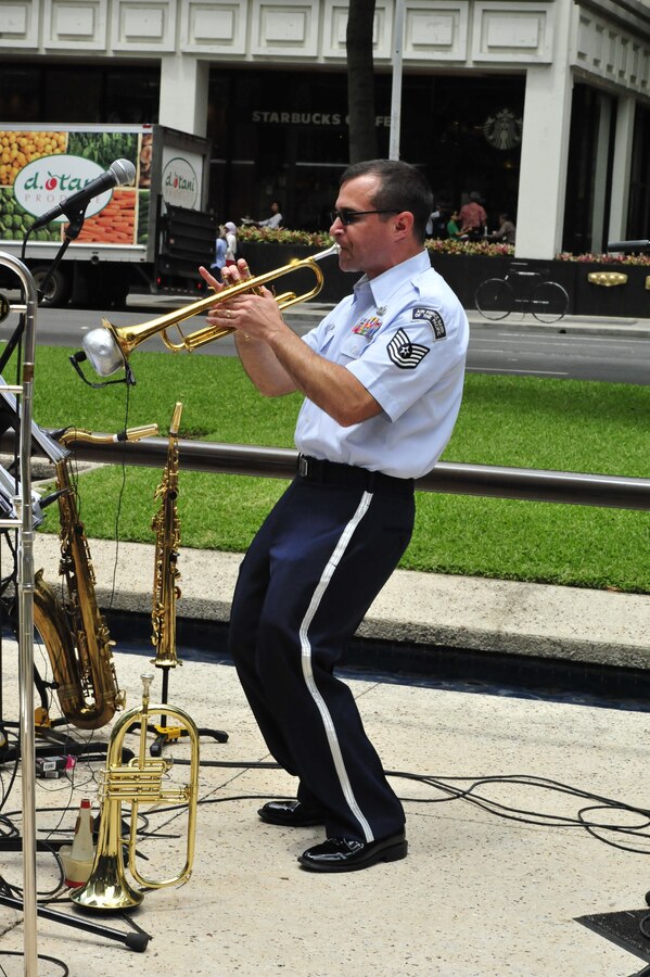 HONOLULU, Hawaii –  TSgt Dave Diamond wails on the trumpet during his solo in downtown Honolulu. Papana, the jazz ensemble with the USAF Band of the Pacific-Hawaii, played at Bishop Square, Apr. 3, 2014. The Band of the Pacific-Hawaii plays over 100 annual public concerts, in efforts to build stronger community and military ties. (US Air Force Photo/SSgt Courtney Clifford/released)