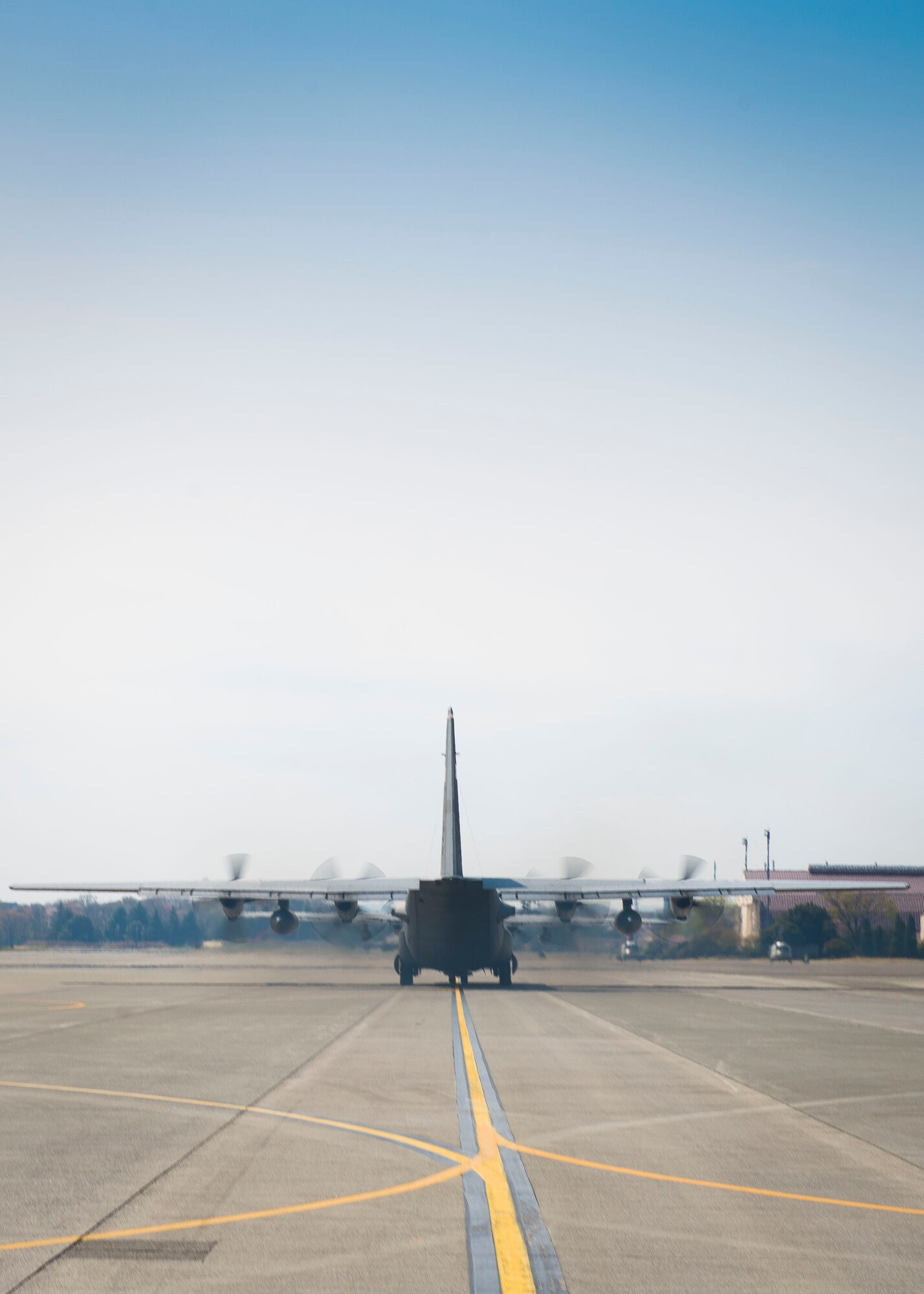 A Yokota C-130 Hercules taxis down the flightline prior to take off in support of Exercise Max Thunder April 9, 2014 at Yokota Air Base, Japan. Max Thunder is a bilateral aerial training exercise that trains U.S. and Republic of Korea Air Force pilots to work closer together against a hostile force. (U.S. Air Force photo by Staff Sgt. Chad C. Strohmeyer/Released)
