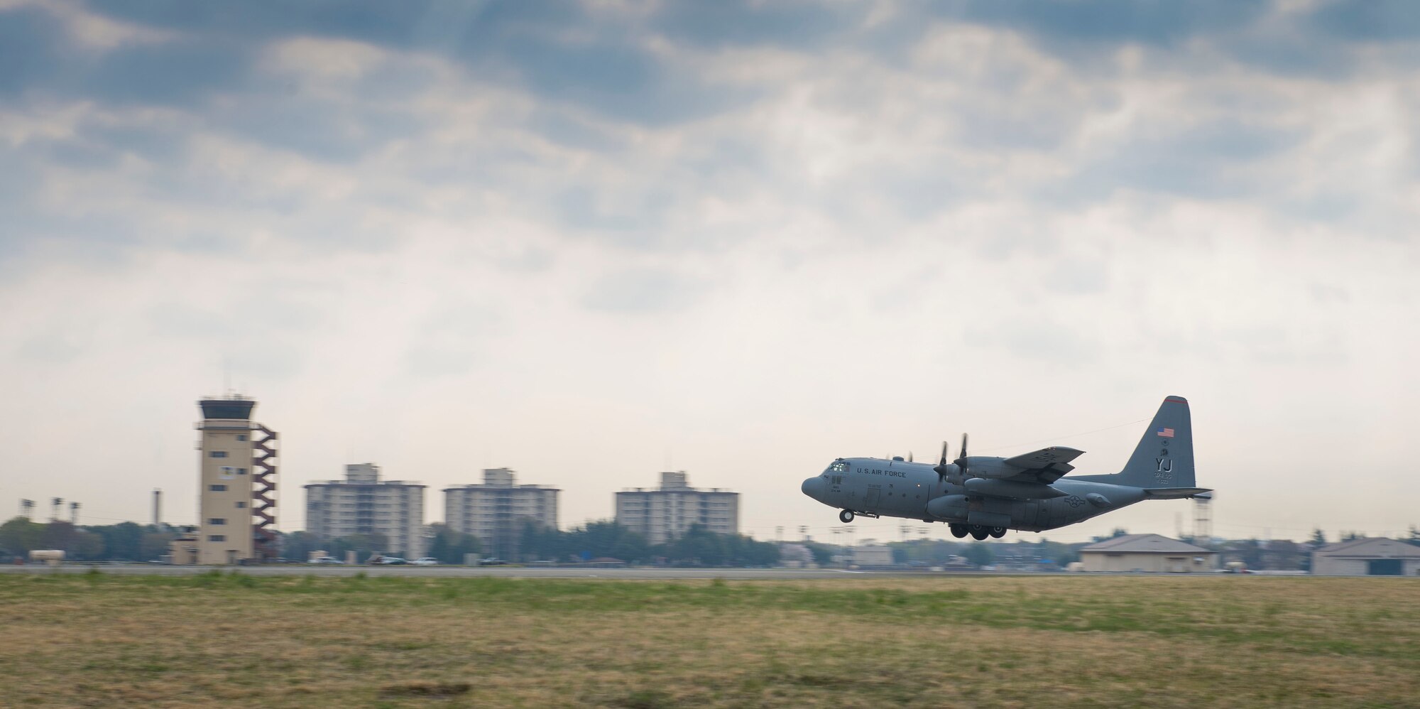 A Yokota C-130 Hercules takes off for the Republic of Korea in support of Exercise Max Thunder April 9, 2014 at Yokota Air Base, Japan. A total of six C-130s deployed to the ROK from Yokota. (U.S. Air Force photo by Staff Sgt. Chad C. Strohmeyer/Released)