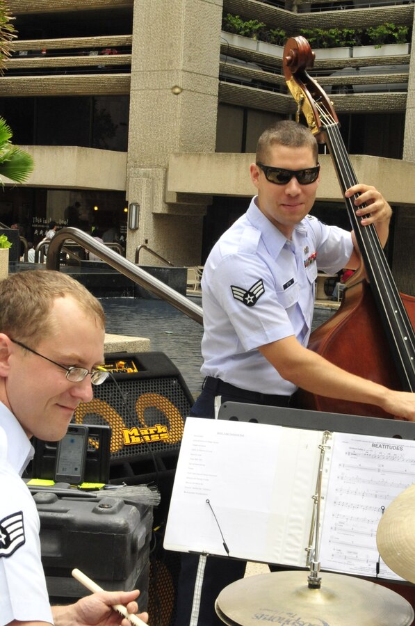 HONOLULU, Hawaii – SSgt B.J. Richard and SrA Andy Detra trade solos in downtown Honolulu. Papana, the jazz ensemble with the USAF Band of the Pacific-Hawaii, played at Bishop Square, Apr. 3, 2014. The Band of the Pacific-Hawaii plays over 100 annual public concerts, in efforts to build stronger community and military ties. (US Air Force Photo/SSgt Courtney Clifford/released)