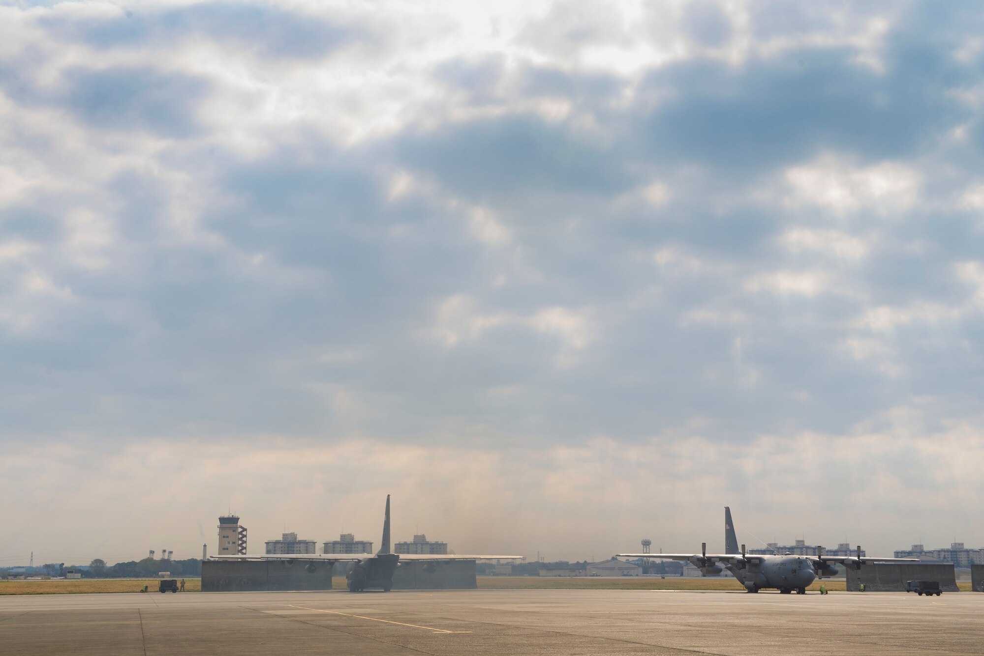 Yokota C-130 Hercules' are prepared for flight in support of Exercise Max Thunder April 9, 2014 at Yokota Air Base, Japan. Max Thunder is a bilateral aerial training exercise that trains U.S. and Republic of Korea Air Force pilots to work closer together against a hostile force. (U.S. Air Force photo by Staff Sgt. Chad C. Strohmeyer/Released)