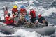 Sailors assigned to the frigate USS Vandegrift (FFG48) help rescue a family with a sick infant in the ship's small boat as part of a joint U.S. Navy, Coast Guard and California Air National Guard effort in the Pacific Ocean, April 6, 2014. The family and four Air National Guard pararescuemen were safely moved from the sailboat to Vandegrift, which then transited to San Diego. (U.S. Navy photo/Released)