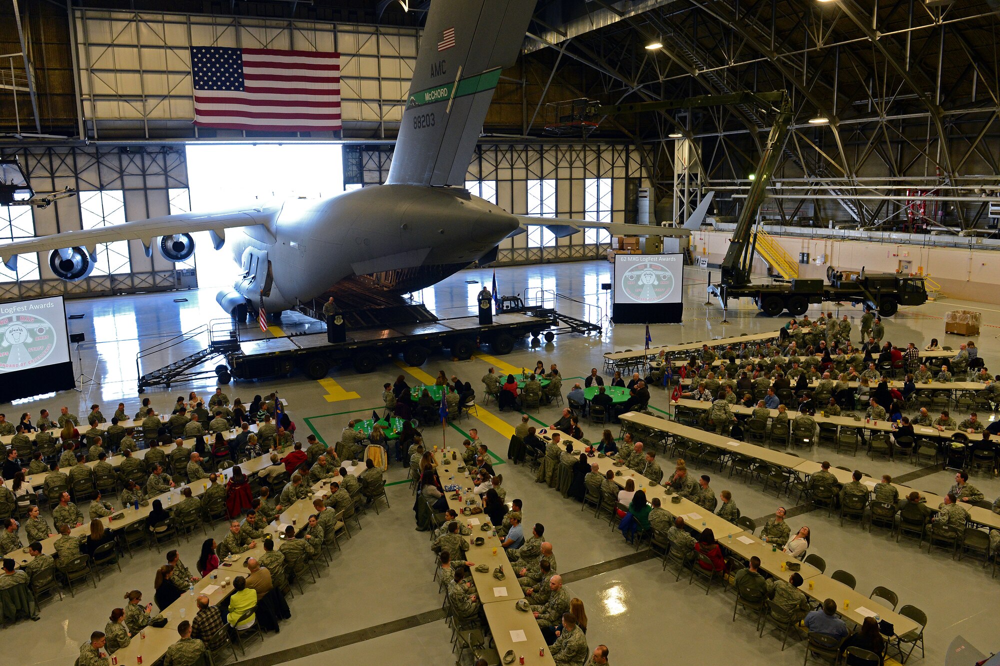 Attendees of the 62nd Maintenance Group LogFest event socialize prior to the start of the event April 4, 2014 at Joint Base Lewis-McChord, Wash. The event kicked off with a social hour, followed by a buffet style barbeque dinner, games, a speech by Chief Master Sgt. Gordon Drake, 62nd Airlift Wing command chief and concluded with award presentations. (U.S. Air Force photo by Airman First Class Jacob Jimenez)
