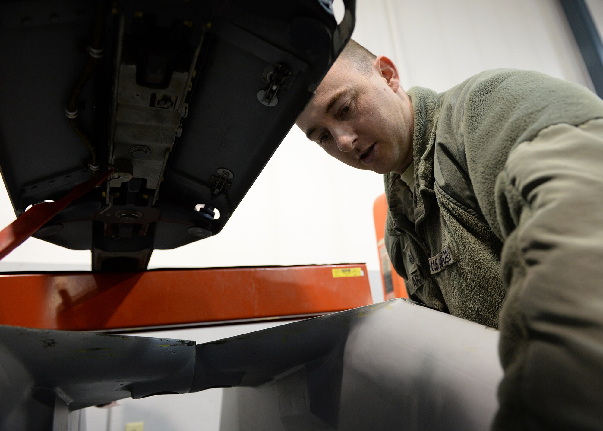 Tech. Sgt. Steven Farrer, 354th Maintenance Group weapons quality assurance inspector, looks through a wiring harness in the armament shop April 7, 2014, Eielson Air Force Base, Alaska. Quality assurance Airmen are maintenance experts who work to identify trends, provide support and advice, and handle difficult or unique maintenance situations from the sections they inspect daily. (U.S. Air Force photo by Staff Sgt. Shawn Nickel/Released)