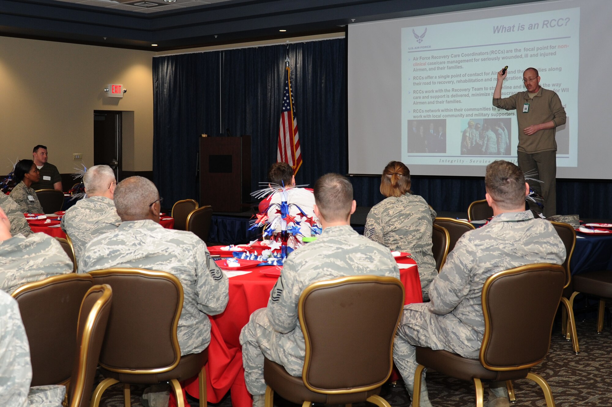 Robert Snyder, Recovery Care Coordinator from Joint-Base Lewis McChord, Wash., speaks with Team Fairchild during the Wounded, Ill and Injured event at the Red Morgan Center at Fairchild Air Force Base, Wash., April 4, 2014. Snyder discussed the structure of Air Force Warrior Division, the overall program, the duties and responsibilities of the Recovery Care Coordinator, Eligibility and clarified definitions. (U.S. Air Force photo by Airman 1st Class Janelle Patiño/Released)