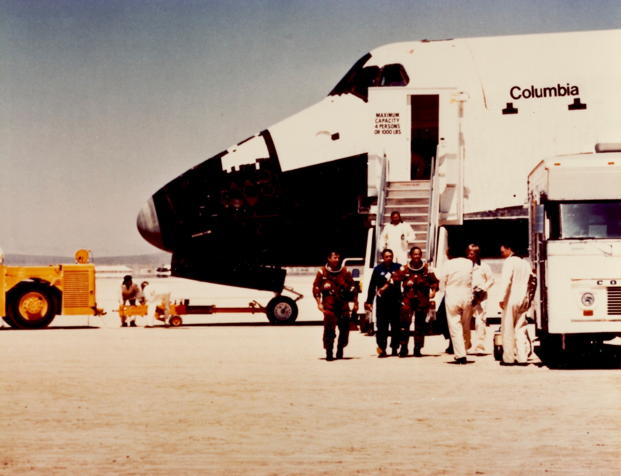 Astronauts John Young and Robert Crippen exit Columbia after landing on Rogers Dry Lake Bed April 14, 1981. (U.S. Air Force photo provided by the Air Force Test Center History Office)