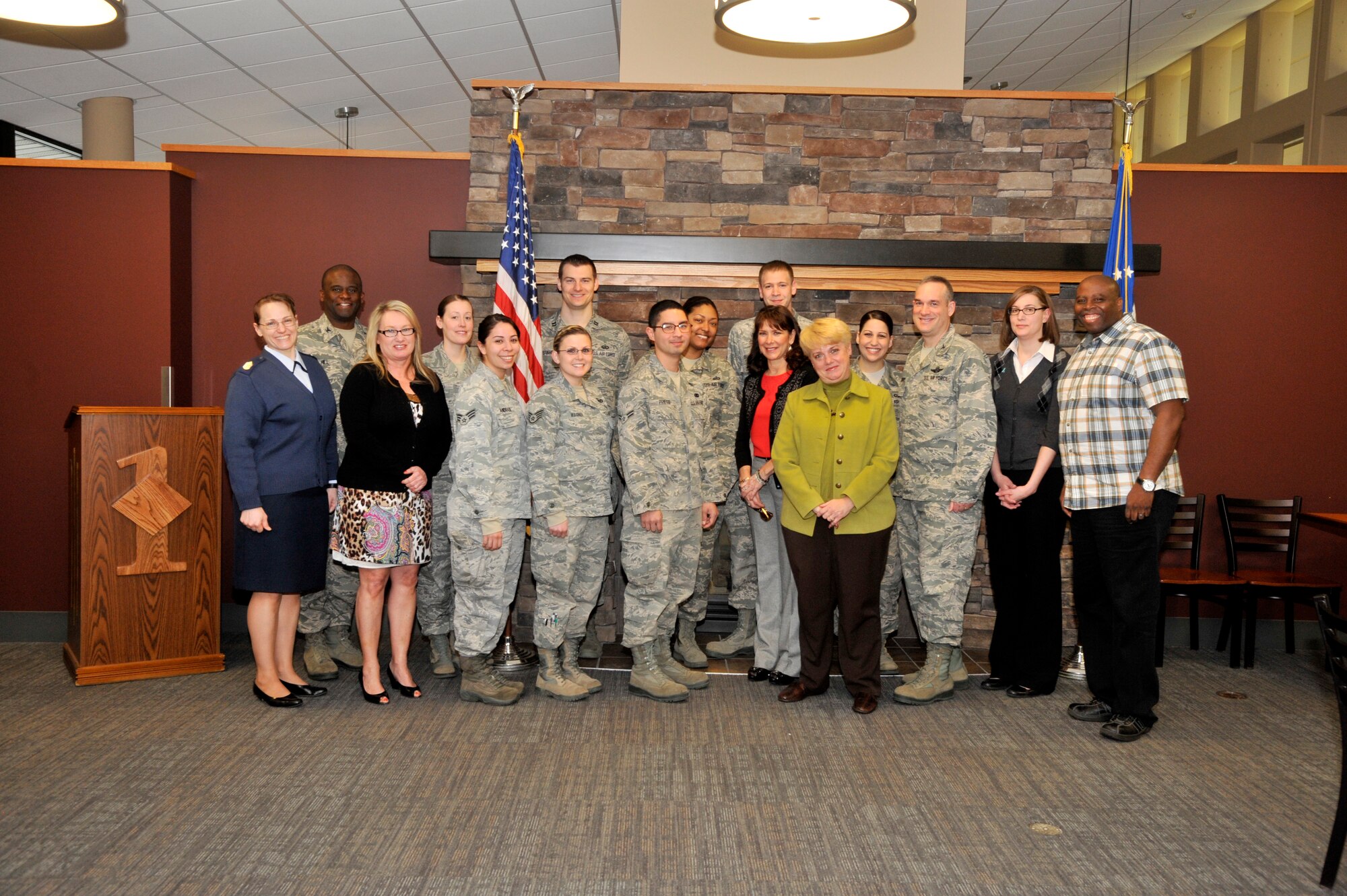 Victim Advocates from Team Fairchild pose with Mary Lauterbach and members of the base leadership during a breakfast at Fairchild Air Force Base, Wash., April 7, 2014. Lauterbach is the mother of sexual assault victim Lance Cpl. Maria Lauterbach who was subsequently murdered by the accused, a colleague whom she worked with. Mary has been traveling around the country telling her daughters story to bring light to sexual assault in the military and how members are cared for during the investigation process. (U.S. Air Force photo by Senior Airman Mary O'Dell/Released)