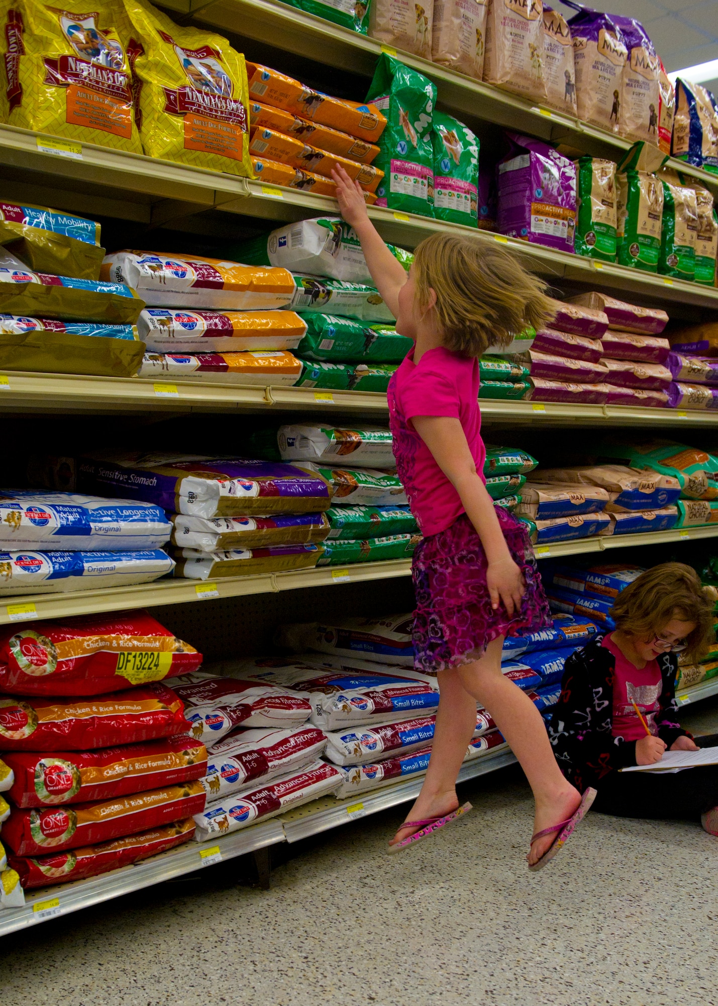 More than 500 Team Holloman dependents enjoy an active evening of learning at the annual Family Math Night at the Holloman Air Force Base Commissary, April 3. The event allows Holloman kids to develop their math skills in an interactive environment through grade-appropriate problems. Those participating could win prizes and also meet Sparky the Fire Dog and McGruff the Crime Dog. (U.S. Air Force photo by Airman 1st Class Chase Cannon/ Released)