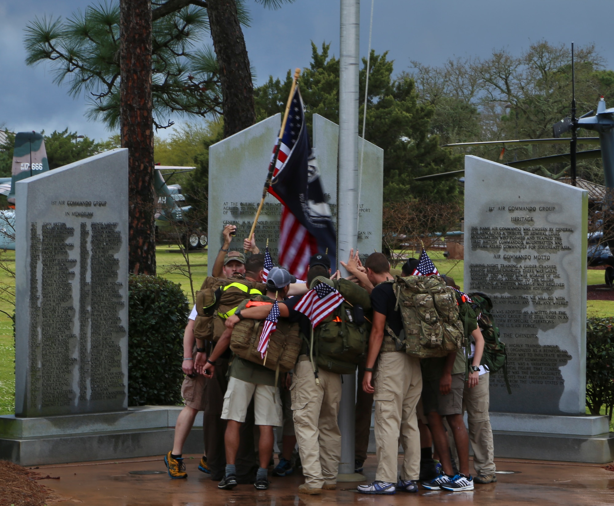 Airmen gather at the Memorial Air Park at Hurlburt Field, Fla., April 4, 2014. Four teams marched 450-miles from MacDill Air Force Base in honor of Air Force Special Operations Command members killed since 9/11. 
(U.S. Air Force photo/Staff Sgt. John Bainter)
