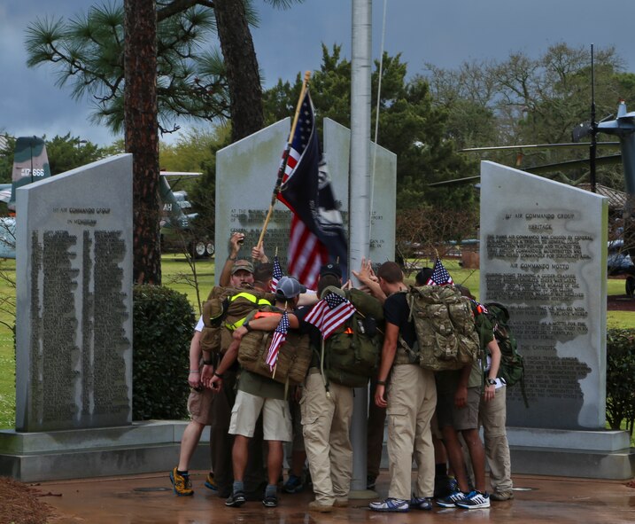 Airmen gather at the Memorial Air Park at Hurlburt Field, Fla., April 4, 2014. Four teams marched 450-miles from MacDill Air Force Base in honor of Air Force Special Operations Command members killed since 9/11. 
(U.S. Air Force photo/Staff Sgt. John Bainter)
