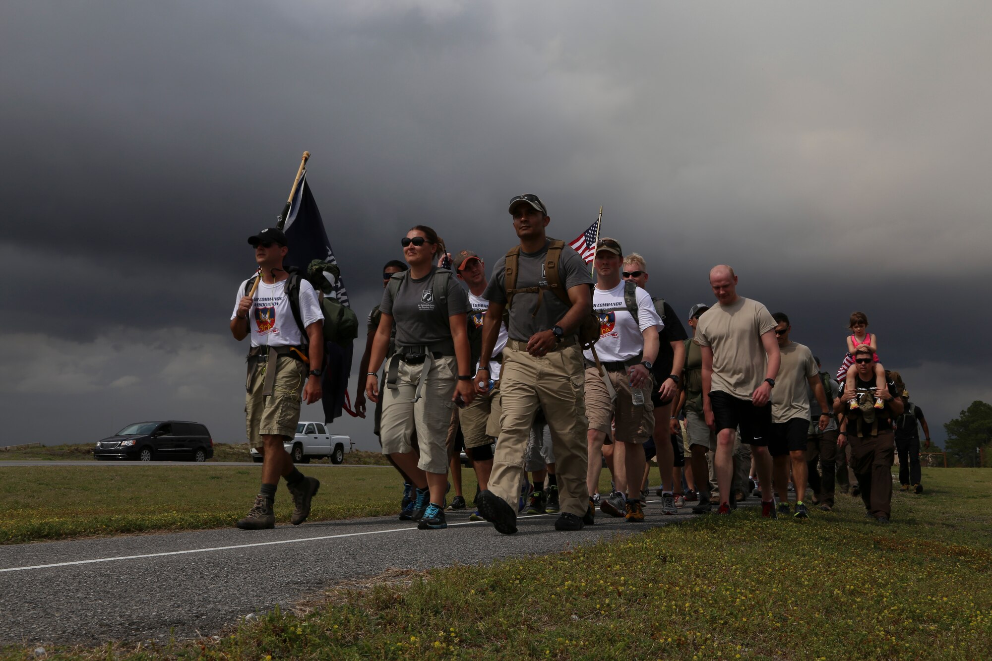 Airmen and supporters march to the Memorial Air Park at Hurlburt Field, Fla., April 4, 2014. Friends, family and supporters joined the Air Commando ruckers during the final leg of their 450 mile journey, which raised funds for charity and honored fallen Air Force Special Operations Command members.
(U.S. Air Force photo/Staff Sgt. John Bainter)

