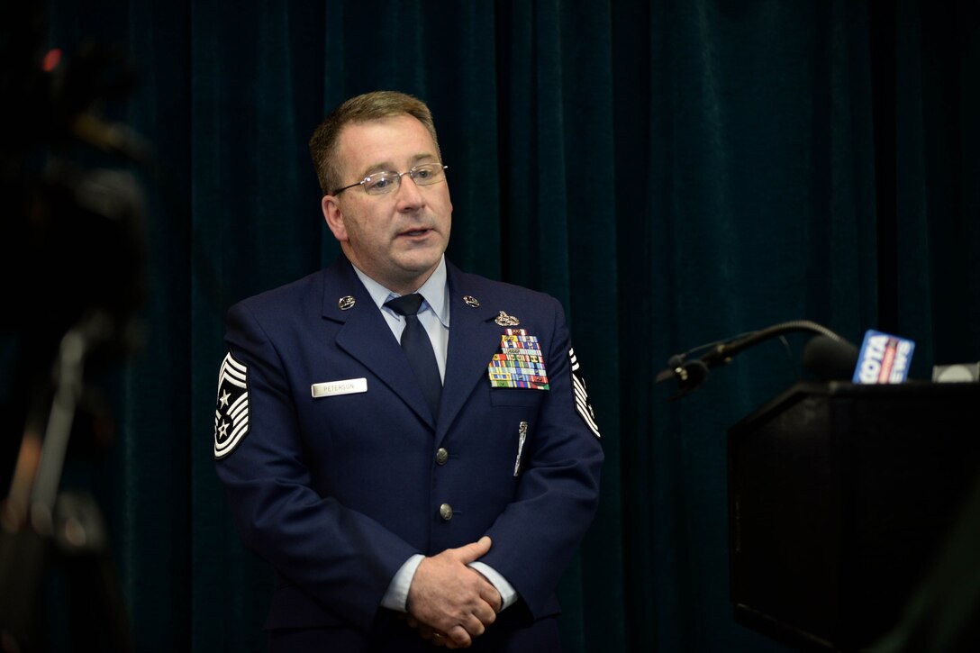 Chief Master Sgt. Kevin Peterson, 28th Bomb Wing command chief master sergeant, provides members of the local media with information on the U.S. Air Force’s force management programs during the State of Ellsworth briefing at Ellsworth Air Force Base, S.D., April 4, 2014. Peterson also provided updates on a variety of initiatives that increase support for the war fighter, such as  the recent renovations at the Bellamy Fitness Center and the reconstruction of the Raider Café. (U.S. Air Force photo by Senior Airman Zachary Hada/Released)