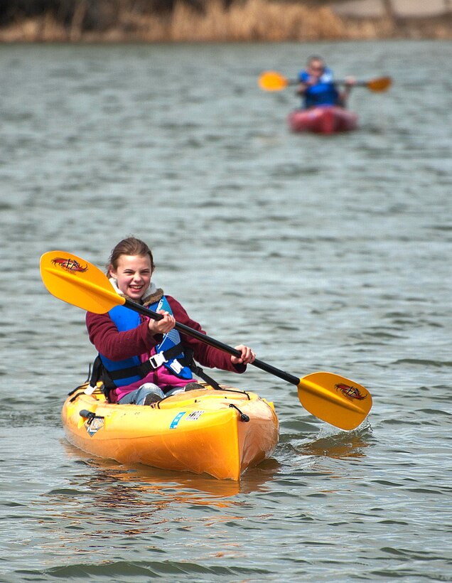 140404-F-GZ967-031 Adrianna Stricek, 10, daughter of Master Sgt. Sean Stricek, 90th Munitions Squadron, shows off her kayaking skills April 4 on the Base Lakes. The BRAT camp spent a day at the lakes, where they fished, kayaked and had a camp fire. (U.S. Air Force photo by Airman 1st Class Brandon Valle)