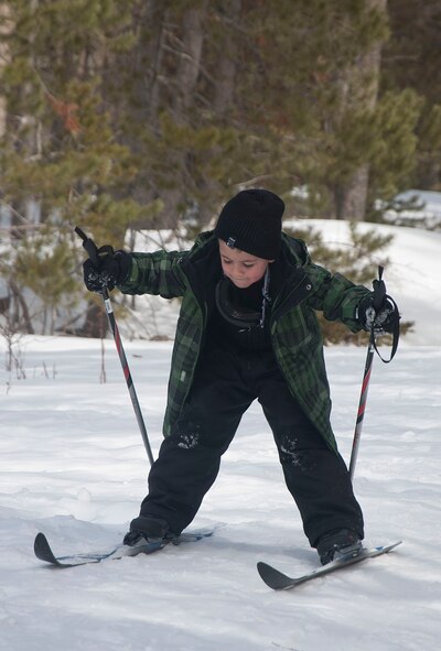 140403-F-GZ967-010 Daegen Moos, 6, son of Tech. Sgt. James Moos, 790th Missile Security Forces Squadron, carefully balances himself as he cross-country skis April 3 during Outdoor Recreation’s BRAT camp. The BRAT camp spent a snow-themed day out at Vedauwoo where they had the opportunity to learn how to cross-country ski and go snow tubing. (U.S. Air Force photo by Airman 1st Class Brandon Valle)