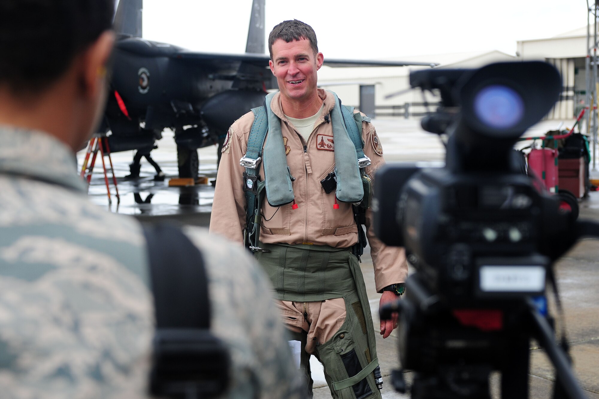 Lt. Col. Todd Dyer, 4th Fighter Wing pilot and squadron commander, answers questions during a media interview, April 8, 2014, at Seymour Johnson Air Force Base, N.C. Dyer, along with nearly 300 other Airmen, were deployed to the 380th Air Expeditionary Wing in Southwest Asia to enhance regional partnerships and support security exercises. (U.S. Air Force photo by Senior Airman John Nieves Camacho)