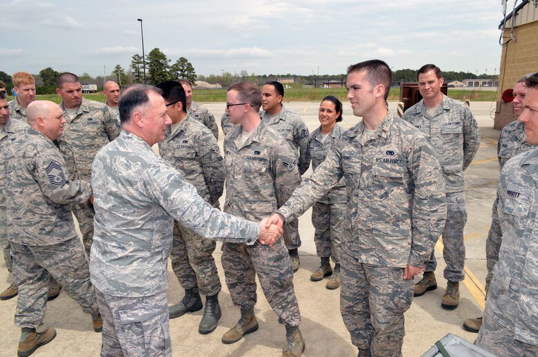 Col. E. Mark Barnes, Air Mobility Command chaplain, left, shakes hands with 2nd Lt. Anthony J. King, 3rd Aerial Port Squadron, during Barnes and Chief Master Sgt. Michael T. O’Donnell, Air Mobility Command chaplain assistant functional manager’s visit to the 3rd Aerial Port Squadron on Apr 8, 2014, Pope Army Airfield, Fort Bragg, N.C. The 3rd Aerial Port squadron serves as the primary supporter of the XVIII Airborne Corps, as well as the 82d Airborne Division and their Global Response Force mission. Port Airmen have also been a constant force multiplier in Afghanistan and Iraq. The aerial porters bring superior job knowledge, skill and leadership to the U.S. Central Command’s area of responsibility. (U.S. Air Force photo/Marvin Krause)