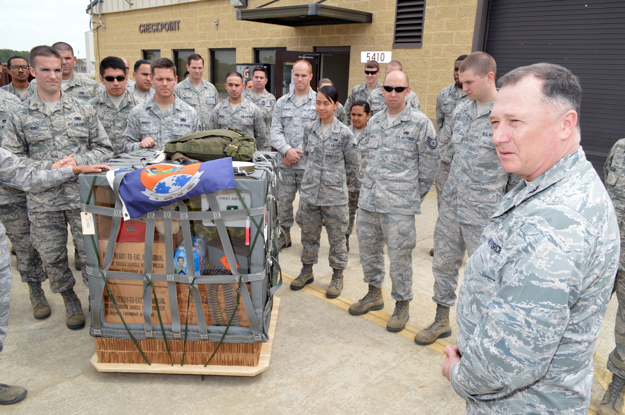 Col. E. Mark Barnes, Air Mobility Command chaplain, right, receives a 3rd Aerial Port Squadron mission briefing during he and Chief Master Sgt. Michael T. O’Donnell, Air Mobility Command chaplain assistant functional manager’s visit to the 43rd Airlift Group, Pope Army Airfield, Fort Bragg, N.C. on Apr 8, 2014. The 3rd Aerial Port squadron serves as the primary supporter of the XVIII Airborne Corps, as well as the 82d Airborne Division and their Global Response Force mission. Port Airmen have also been a constant force multiplier in Afghanistan and Iraq. The aerial porters bring superior job knowledge, skill and leadership to the U.S. Central Command’s area of responsibility. (U.S. Air Force photo/Marvin Krause)