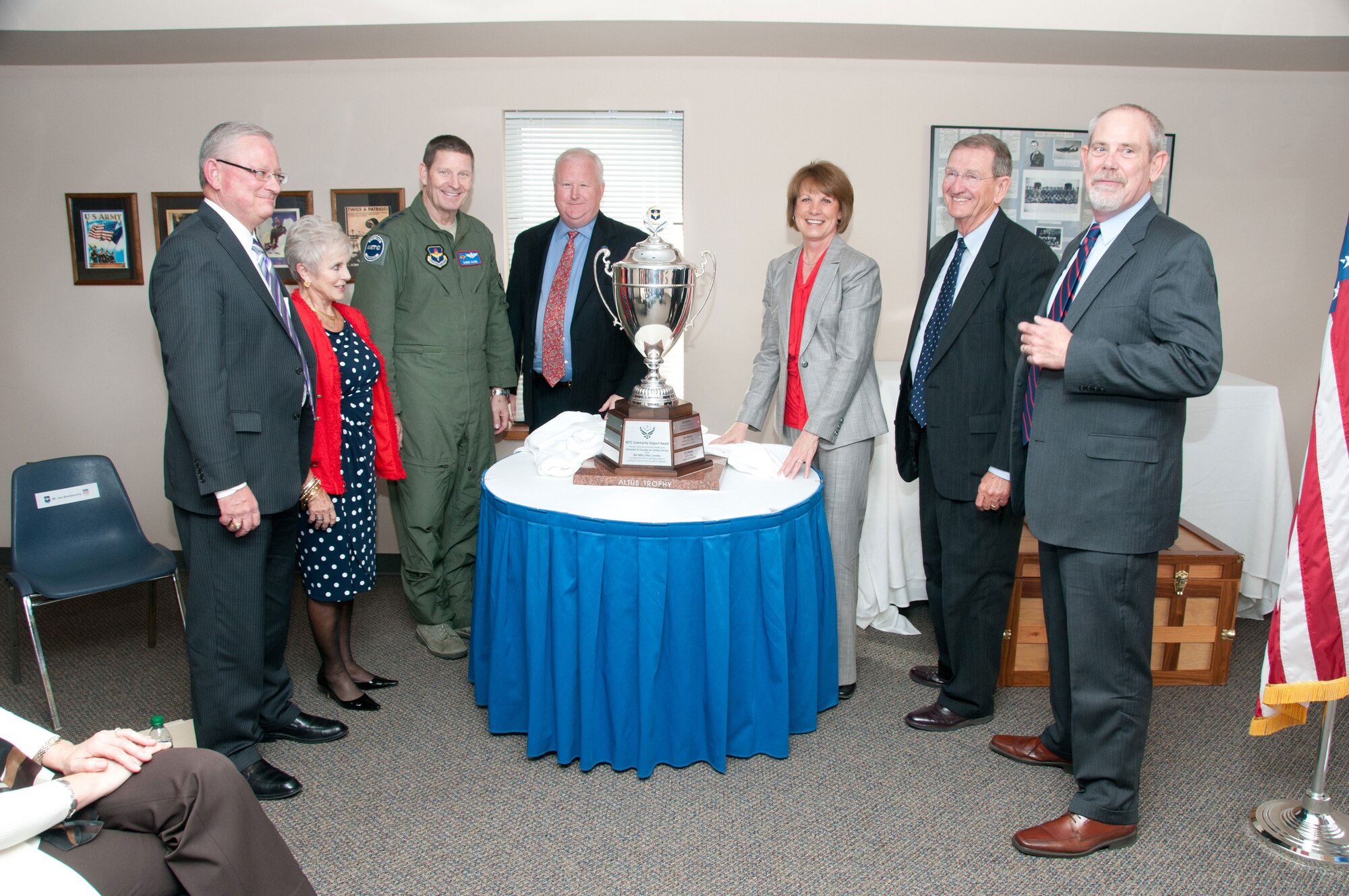 Gen. Robin Rand, commander of Air Education and Training Command, awards the Altus Trophy to Enid, Okla., community leaders April 2 at the Woodring Regional Airport in Enid. The Altus Trophy is presented to the civilian community that best supports its host AETC base. Enid received the trophy for the first time since the awards inception. (U.S. Air Force photo/Terry Wasson)