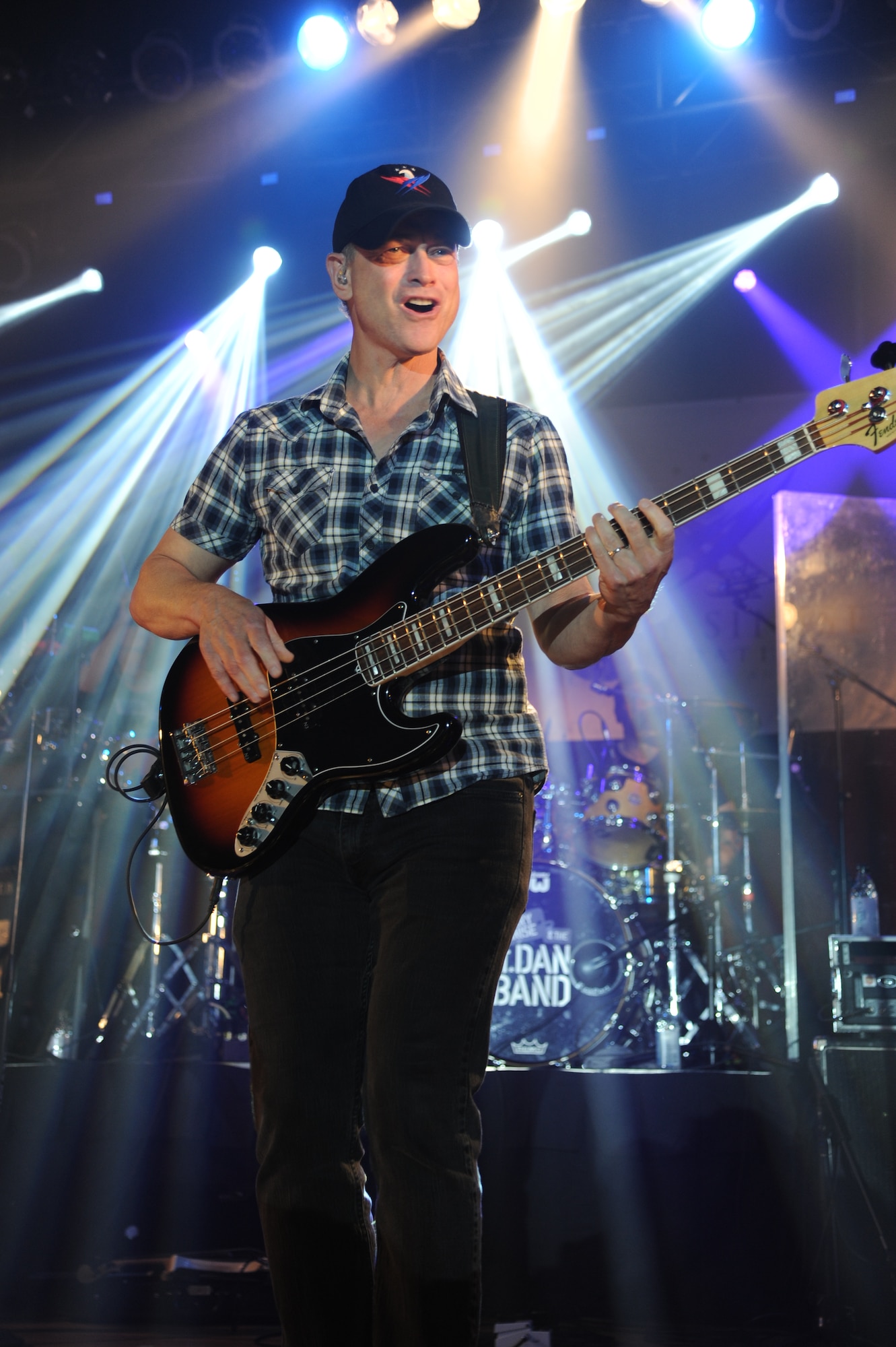 Gary Sinise of Gary Sinise & the Lt. Dan Band plays his electric bass guitar on stage during a concert April 4, 2014, at the Welch Theater, Keesler Air Force Base, Miss.  The band visited Keesler during their morale-boosting 2014 USO tour of U.S. military bases.  They are also a program of the Gary Sinise Foundation, a nonprofit organization that supports and honors national defenders, veterans and first responders. (U.S. Air Force photo by Kemberly Groue)