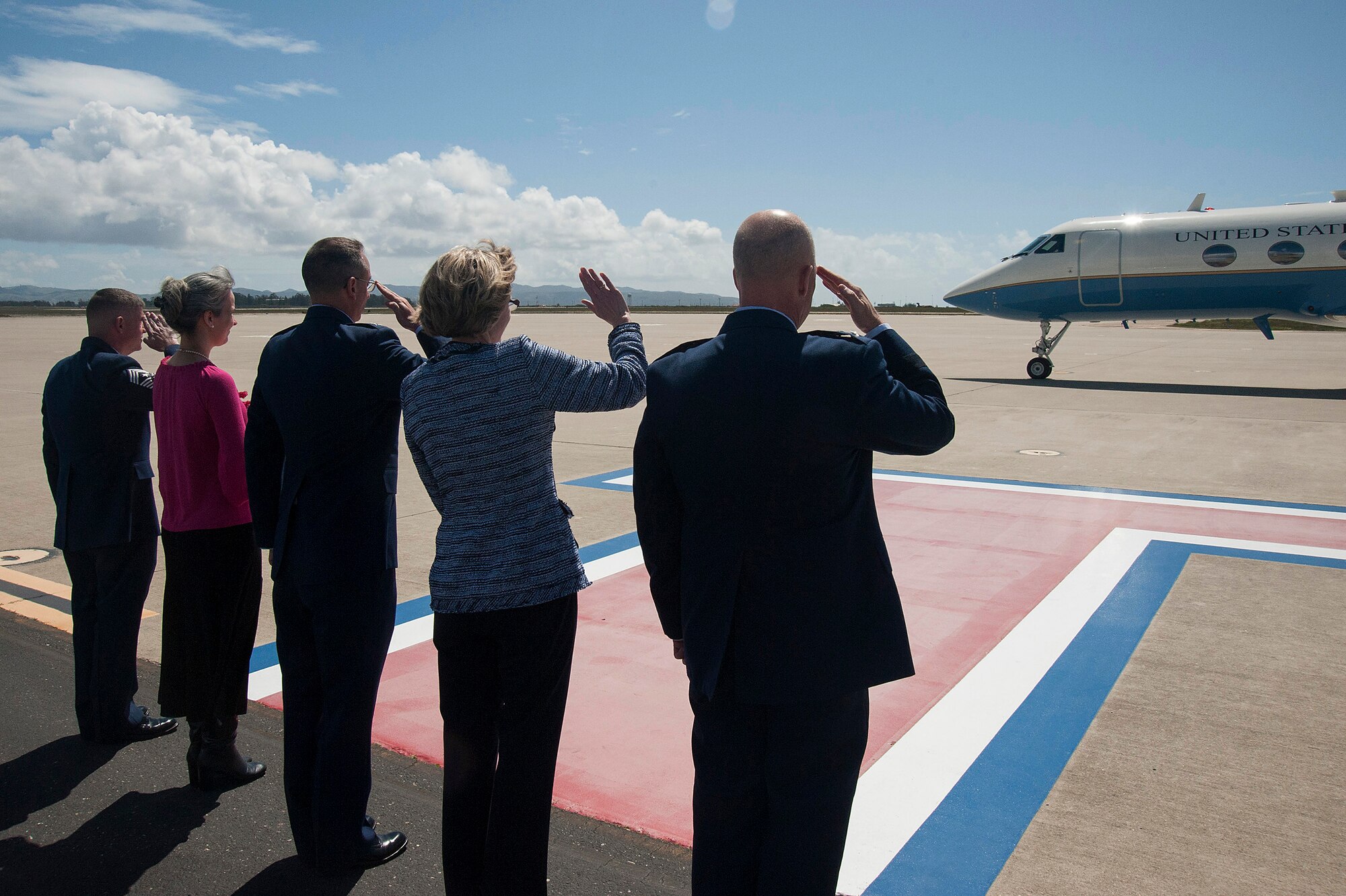 Senior leaders from 14th Air Force and 30th Space Wing stand with their spouses to salute General Shigeru Iwasaki, Chief of Staff, Joint Staff Japanese Self Defense Forces, as his plane departs April 1, 2014, Vandenberg Air Force Base, Calif. General Iwasaki, his wife and members of his senior staff visited Vandenberg to learn more about the mission of the 14th Air Force and 30th Space Wing. (U.S. Air Force Photo/Michael Peterson) 