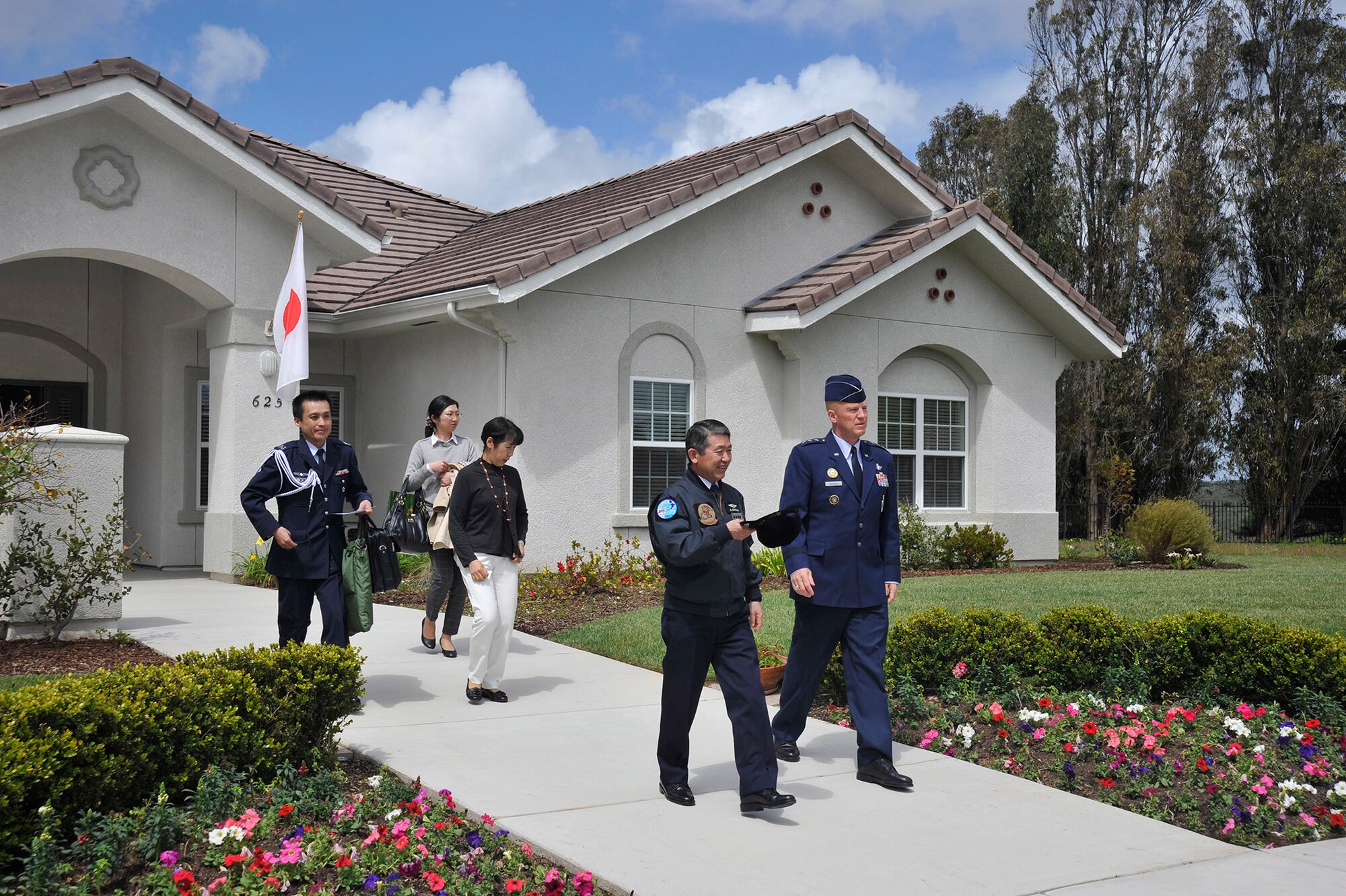 General Shigeru Iwasaki, Chief of Staff, Joint Staff Japanese Self Defense Forces, and Lt. Gen. John W. “Jay” Raymond, Joint Functional Component Command for Space and 14th Air Force commander, continue on their base tour after a lunch at Raymond’s house, April 1, 2014, Vandenberg Air Force Base, Calif. General Iwasaki, his wife and members of his senior staff visited Vandenberg to learn more about the mission of the 14th Air Force and 30th Space Wing. (U.S. Air Force Photo/Michael Peterson)