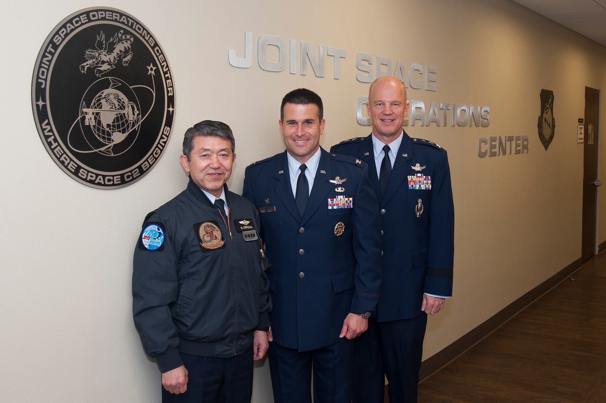 (Left to Right) General Shigeru Iwasaki, Chief of Staff, Joint Staff Japanese Self Defense Forces, Col. John Wagner, 614 Air and Space Operations Center commander and Joint Space Operations Center Director, and Lt. Gen. John W. “Jay” Raymond, Joint Functional Component Command for Space and 14th Air Force commander, pose for a photo inside the JSpOC, April 1, 2014, Vandenberg Air Force Base, Calif. General Iwasaki, his wife and members of his senior staff visited Vandenberg to learn more about the mission of the 14th Air Force and 30th Space Wing. (U.S. Air Force Photo/Michael Peterson) 