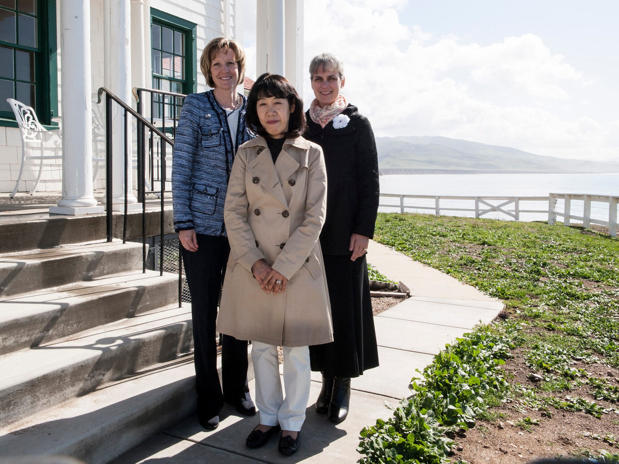 (Left to right) Mollie Raymond, wife of Lt. Gen. John W. “Jay” Raymond, JFCC Space and 14th AF commander, Toshiko Iwasaki, wife of General Shigeru Iwasaki, Chief of Staff, Joint Staff Japanese Self Defense Forces, and Christine Balts, wife of Col. Keith Balts, 30th Space Wing commander, pose in front of the boat house, April 1, 2014, Vandenberg Air Force Base, Calif. General Iwasaki, his wife and members of his senior staff visited Vandenberg to learn more about the mission of the 14th Air Force and 30th Space Wing. (U.S. Air Force Photo/Airman 1st Class Yvonne Morales) 