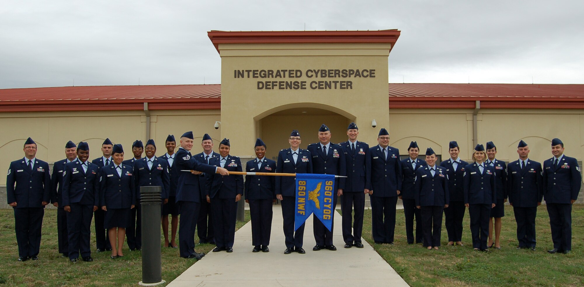Reservists from the 860th Network Warfare Flight pose for a group shot after a uniform inspection April 5 at the Integrated Cyberspace Defense Center here.  The 860th NWF is one of 10 units that make up the 960th Cyberspace Operations Group.  The flight's mission is to provide trained personnel who monitor Air Force communications-computer systems and determine if exposed information is a potential intelligence threat.  The cyber defense analysts, led by Lt. Col. Lori Jones, 860th NWF commander, also assist in integrating and conducting information operations that shape the international security environment and, when necessary, the battle space.  (U.S. Air Force photo by 1st Lt. Lori Fiorello)