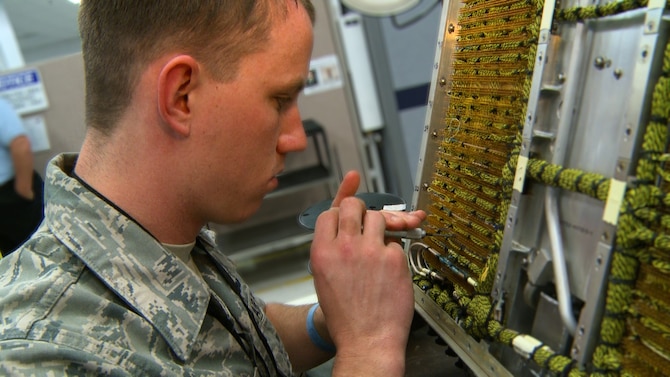 Senior Airman Zackery Noorlun works on an electronic jammer wire panel for a B-1B Lancer bomber at Robins Air Force Base, Ga. in this April 2013 file photo. The Air Force Life Cycle Management Center partners with industry to deliver cost effective acquisition solutions and product support for Air Force weapon systems like the B-1B. Airman Noorlun is a depot avionics journeyman with the 567th Electronics Maintenance Squadron. (U.S. Air Force photo/Matthew Clouse) 