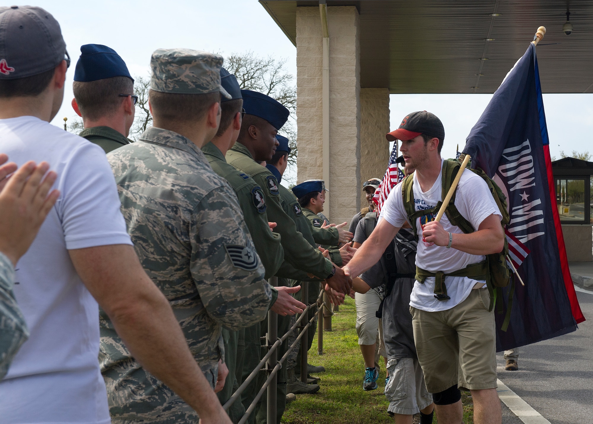Air Commandos welcome home the Air Commando Ruckers after completing the final leg of the 3rd Annual Air Commando Ruck March in Fort Walton Beach, Fla., April 4, 2014. The Air Commando Ruckers marched 450 miles from MacDill Air Force Base, Fla., to Hurlburt Field, Fla. (U.S. Air Force photo/Airman 1st Class Jeff Parkinson)