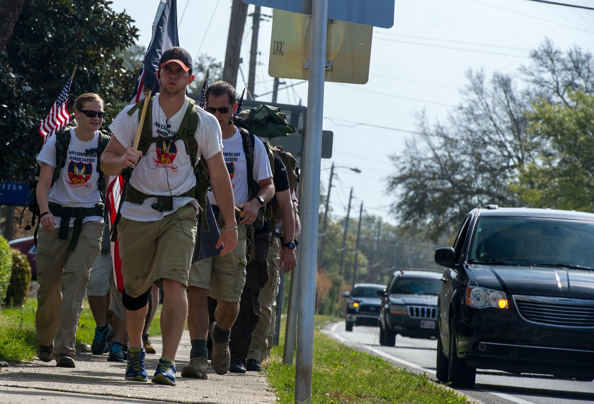 Senior Airman Matt Flynn, 1st Special Operations Force Support Squadron fitness journeyman, leads the Air Commando Ruckers during the final leg of the 3rd Annual Air Commando Ruck March in Fort Walton Beach, Fla., April 4, 2014. The Air Commando Ruckers marched 450 miles from MacDill Air Force Base, Fla., to Hurlburt Field, Fla. (U.S. Air Force photo/Airman 1st Class Jeff Parkinson)