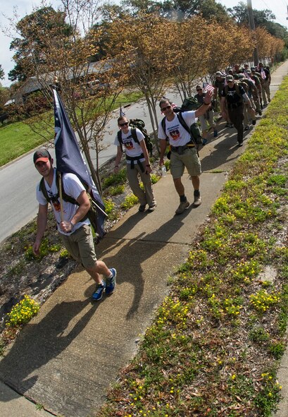 The Air Commando Ruckers complete their final leg of the 3rd Annual Air Commando Ruck March in Fort Walton Beach, Fla., April 4, 2014. The Air Commando Ruckers marched 450 miles from MacDill Air Force Base, Fla., to Hurlburt Field, Fla. (U.S. Air Force photo/Airman 1st Class Jeff Parkinson)