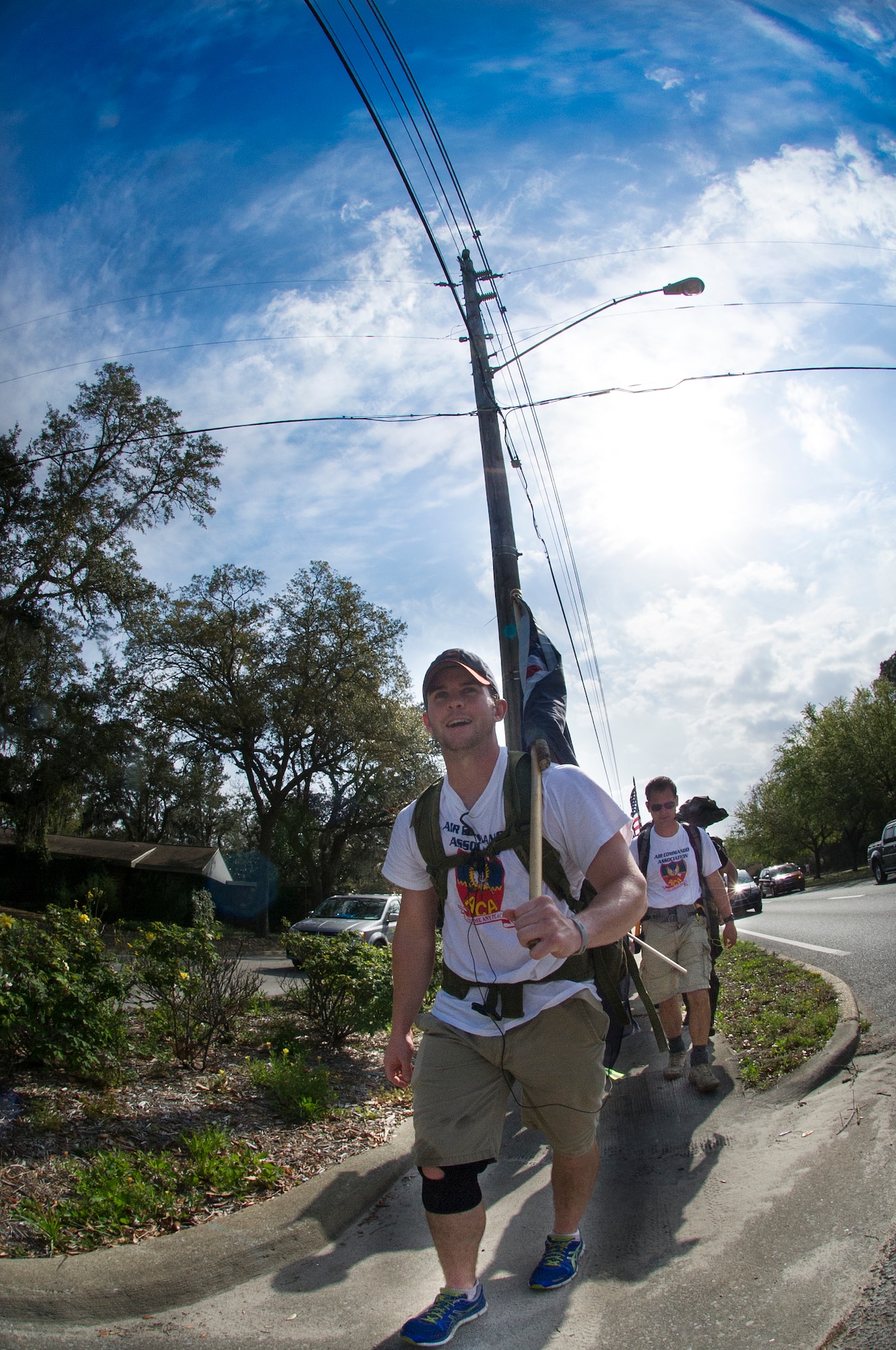 Senior Airman Matt Flynn, 1st Special Operations Force Support Squadron fitness journeyman, leads the Air Commando Ruckers during the final leg of the 3rd Annual Air Commando Ruck March in Fort Walton Beach, Fla., April 4, 2014. The Air Commando Ruckers marched 450 miles from MacDill Air Force Base, Fla., to Hurlburt Field, Fla. (U.S. Air Force photo/Airman 1st Class Jeff Parkinson)